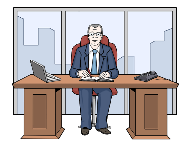 Der Chef sitzt im Büro am Schreibtisch.